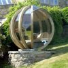 garden pods - photo of a rotating lounge garden pod with glass walls.